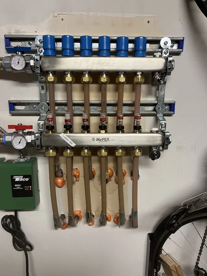 Plumber performing Water Heater Repair at a residential property in Purcell